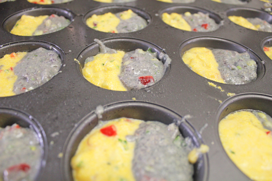 Blue and Yellow batter side by side in muffin tin.
