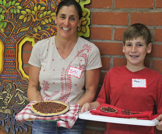 Mother and Son, Beth and Adam showing off their pies in our Pie Cooking Class. 