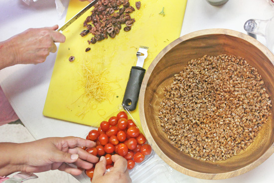 Ingredients for Italian Farro Salad with grape tomatoes, feta cheese and Kalamata olives. 