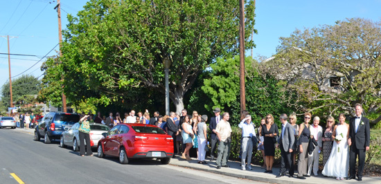 Wedding Guests walk the short block from the church to our home on a picture perfect day! Photo by Mike Gitchell. 